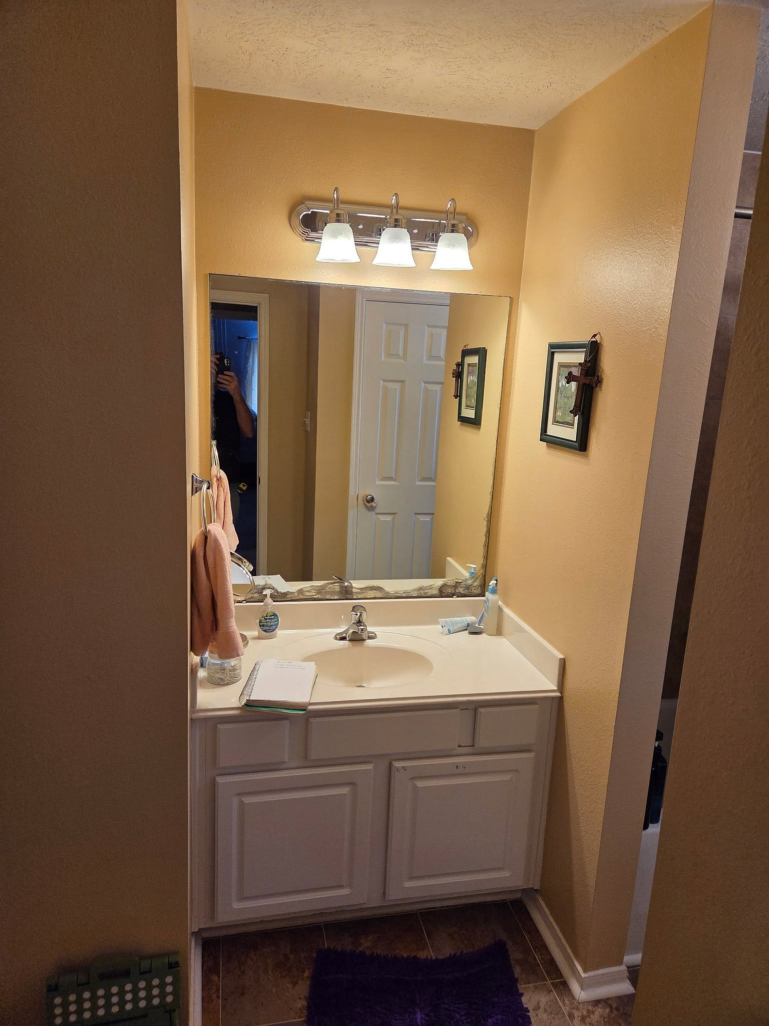 A dated builder-grade vanity before Reeder
